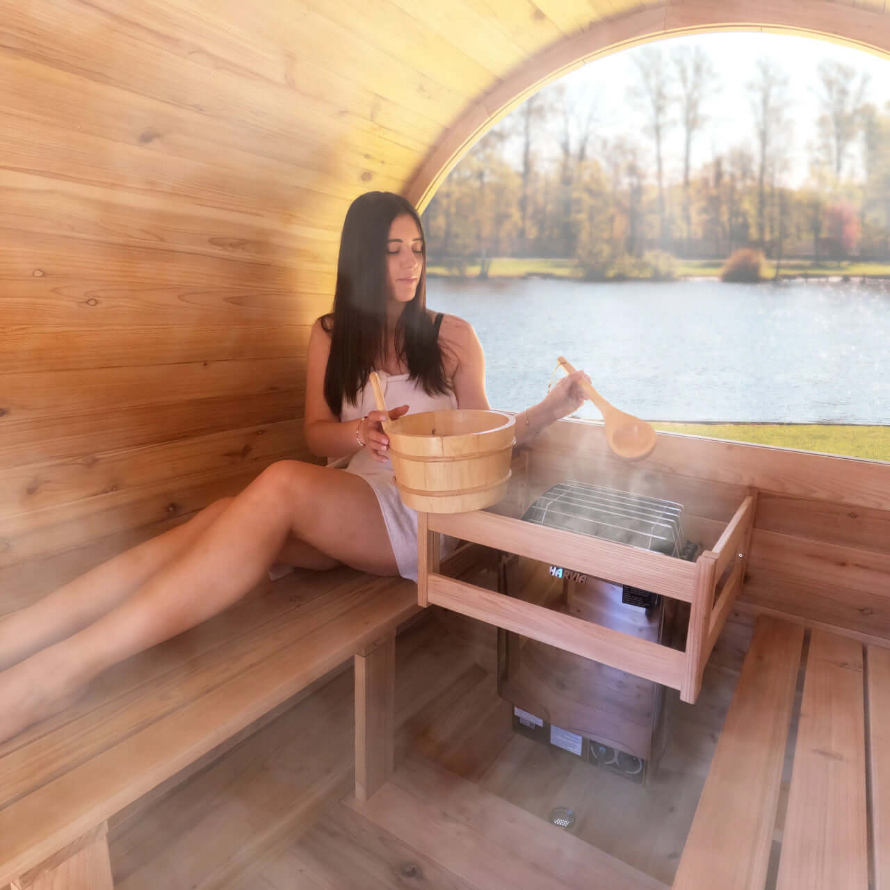 Red Cedar Barrel Sauna with Panoramic Window - 8 kW UL Certified KIP Harvia Heater - 6-8 Person - Interior image with model user